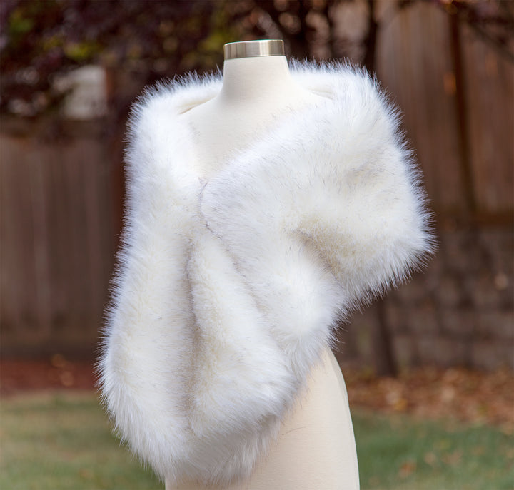 Light ivory faux fur wrap with black tips